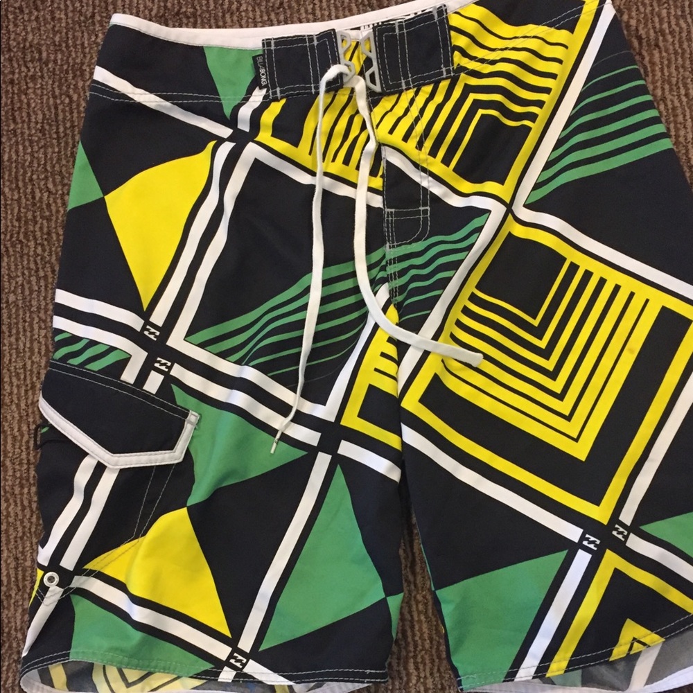 Green, black, and yellow Billabong board shorts